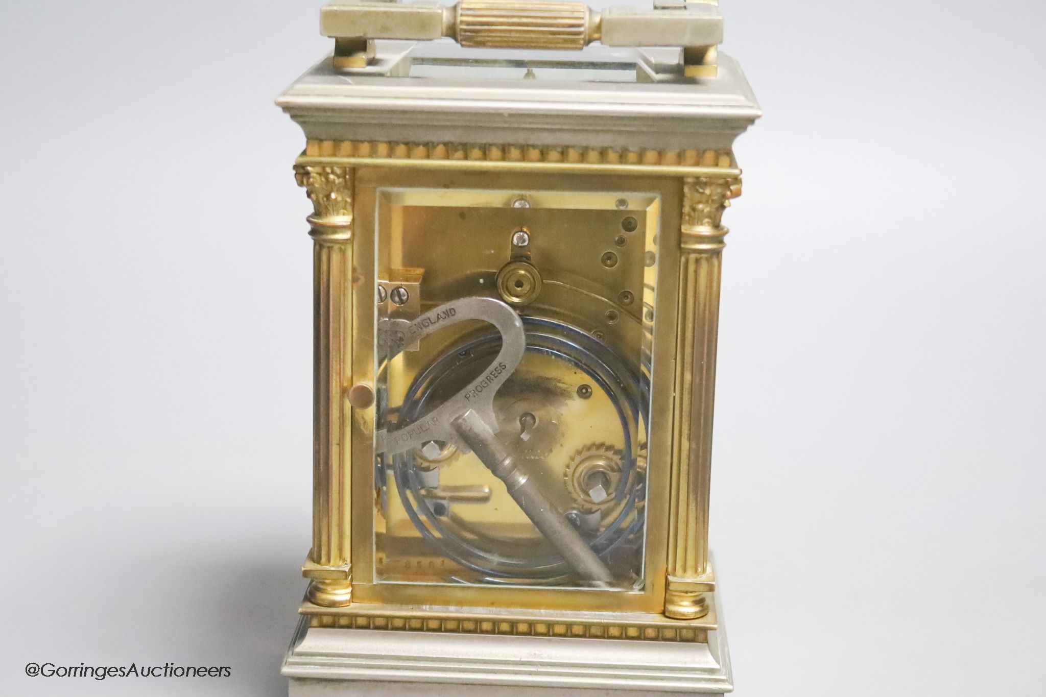 A silvered and gilt brass Corinthian pattern carriage clock, height 17cm